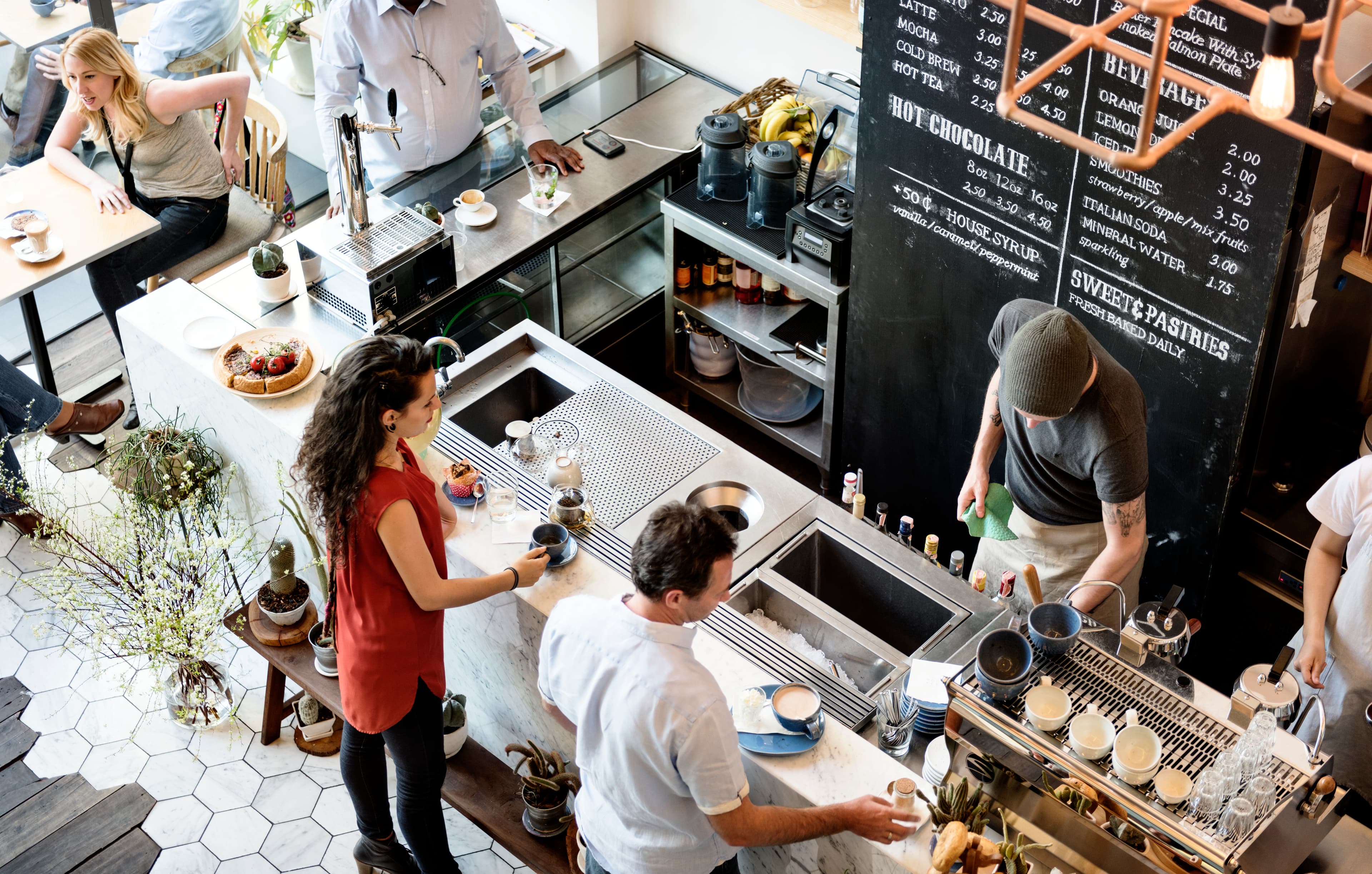 Customers and baristas inside Bugonia's Federal Hill coffee shop